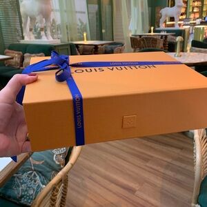 Brand new authentic medium size Louis Vuitton box with LV ribbon, lock closure